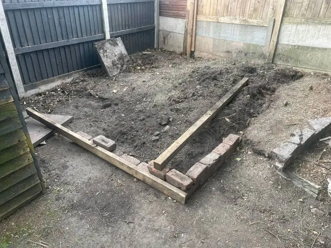 Before: Porcelain patio with sleeper edging