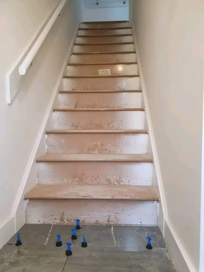 Before: Marble-effect staircase